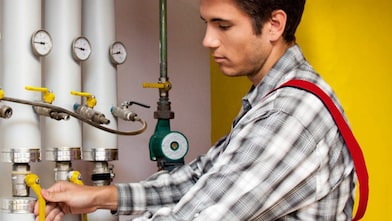 Guy cleaning oil heating system