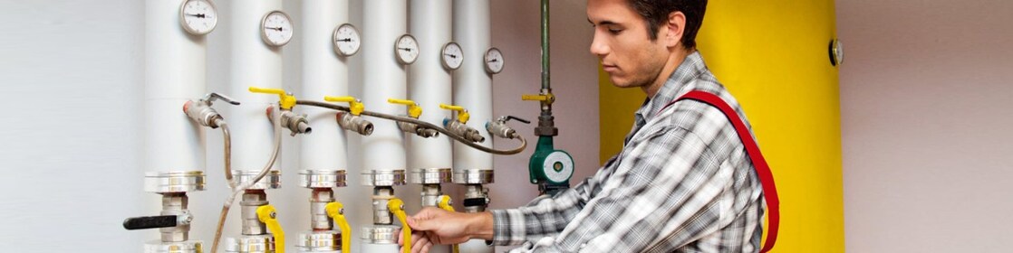 Guy cleaning oil heating system