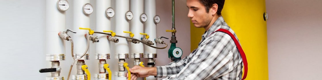 Guy cleaning oil heating system