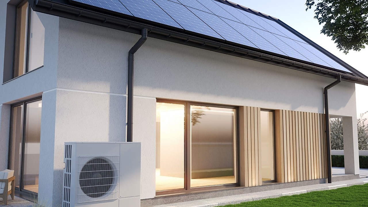 3D-Illustration eines energieeffizienten Hauses mit Wärmepumpe neben dem Gebäude und Sonnenkollektoren auf dem Dach